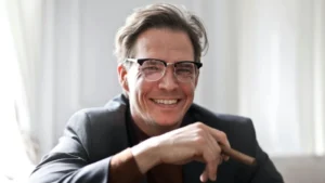 Adult man smiling, showing Invisalign for crowded teeth