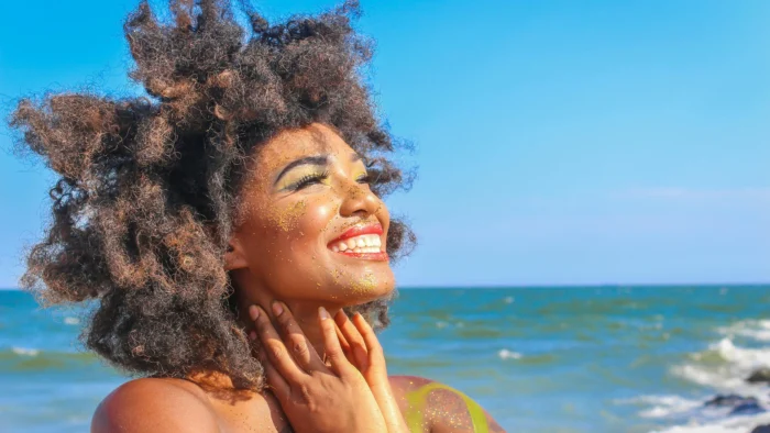 Woman smiling with invisible braces for crowded teeth